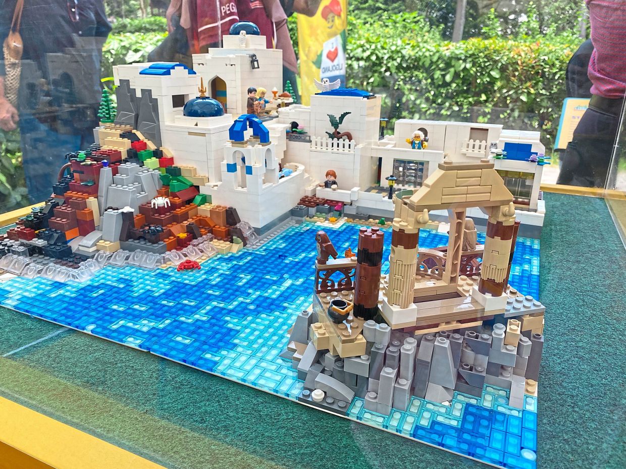 The Lucira Lego creation showcases Santorini’s white buildings, blue domes and cliffside pools in intricate detail.