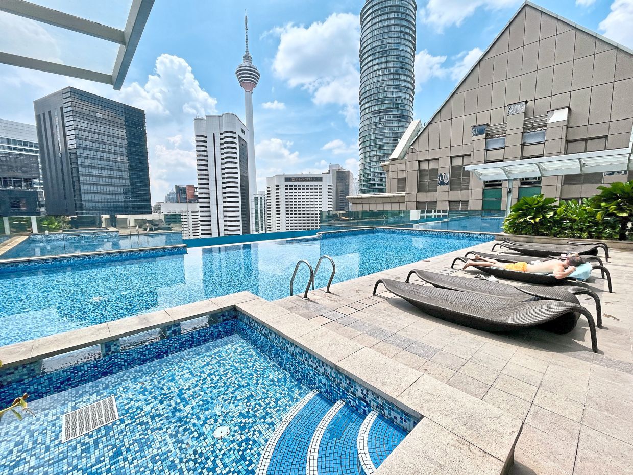The swimming pool offers stunning views of Kuala Lumpur’s skyline of soaring skyscrapers.