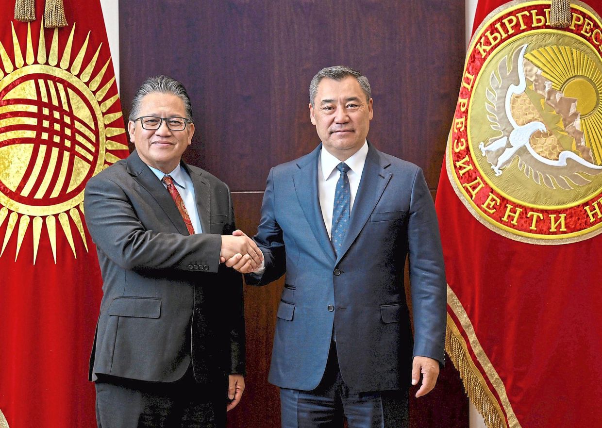 Cementing ties: The writer (left) was delighted to visit the majestic Yntymak Ordo Presidential Palace at the invitation of President Zhaparov. — Facebook