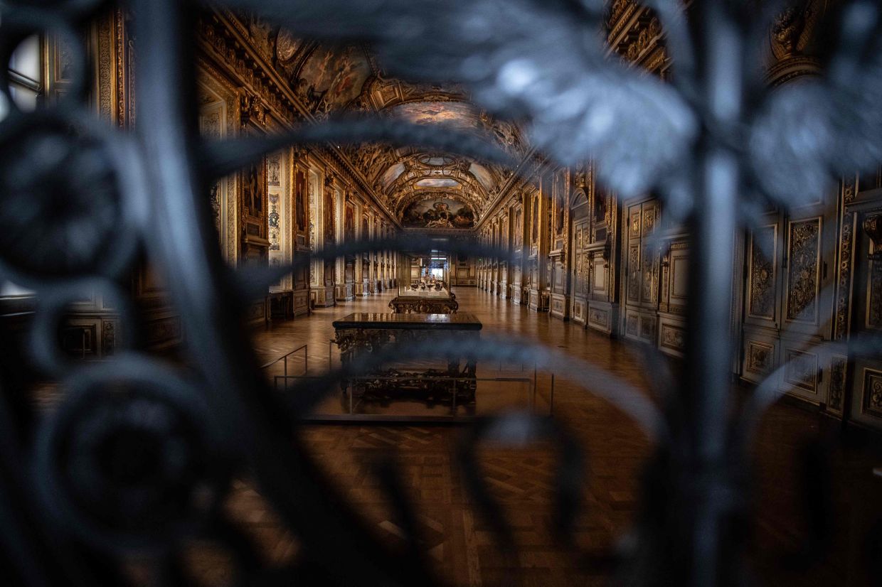 This file photograph shows the closed gate of the 'Gallerie d'Apollon' (Apollo's Gallery) and The French Crown Jewels, at the Louvre museum in Paris. Photo: AFP