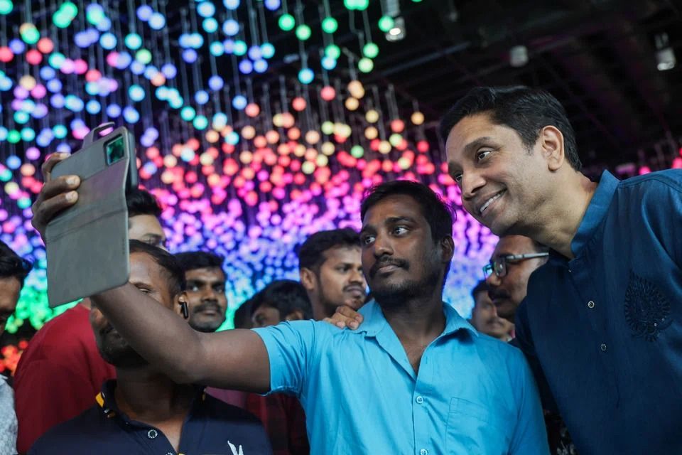 Minister of State for Manpower Dinesh Vasu Dash (right) joined the participants in the celebrations. -Photo: ST