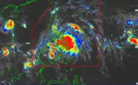 Tropical storm kills family of five as it hits Philippines