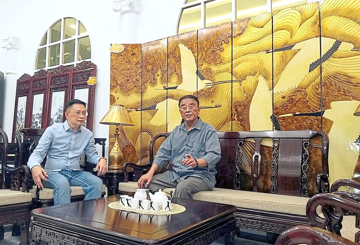 Lim (left) and Li at the outlet which specialises in manufacturing custom Chinese rosewood furniture.