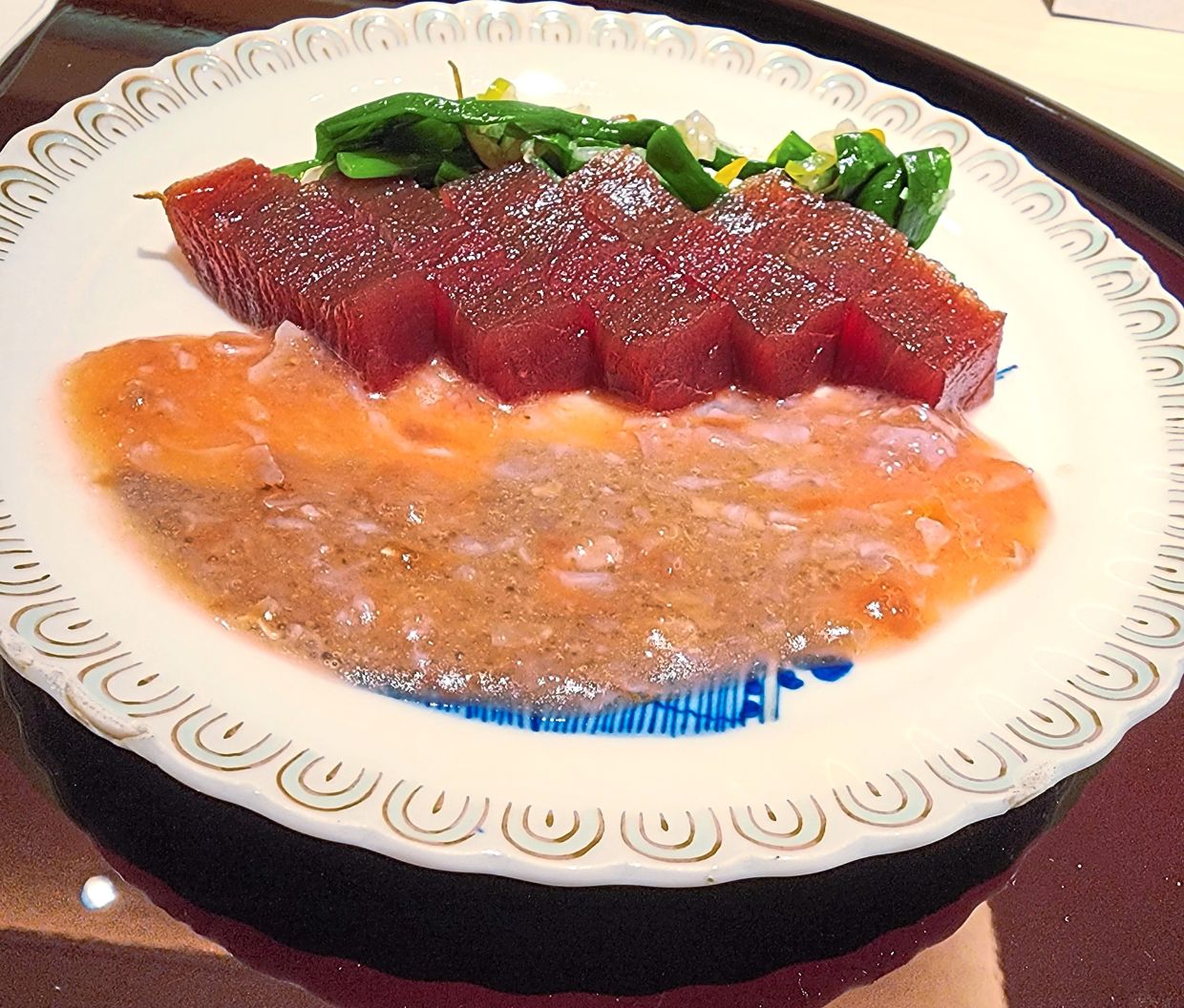 Soy sauce tuna with fish entrails sauce ... a funky- sounding combination that works in reality.