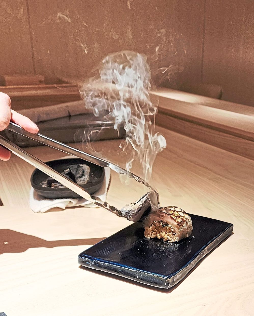 The mackerel box sushi features mackerel that has been lightly stamped with hot charcoal to give it a smoky countenance. — Photos: ABIRAMI DURAI/The Star