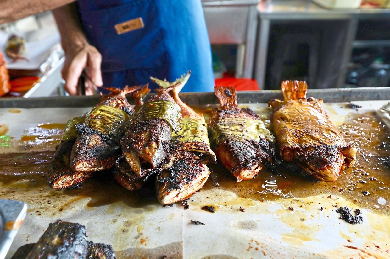 Mackerel and tilapia (right) are just some of the offerings in Jalan Bellamy, Kuala Lumpur.