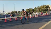 Youngest triathlete Jun You braves pain to finish race