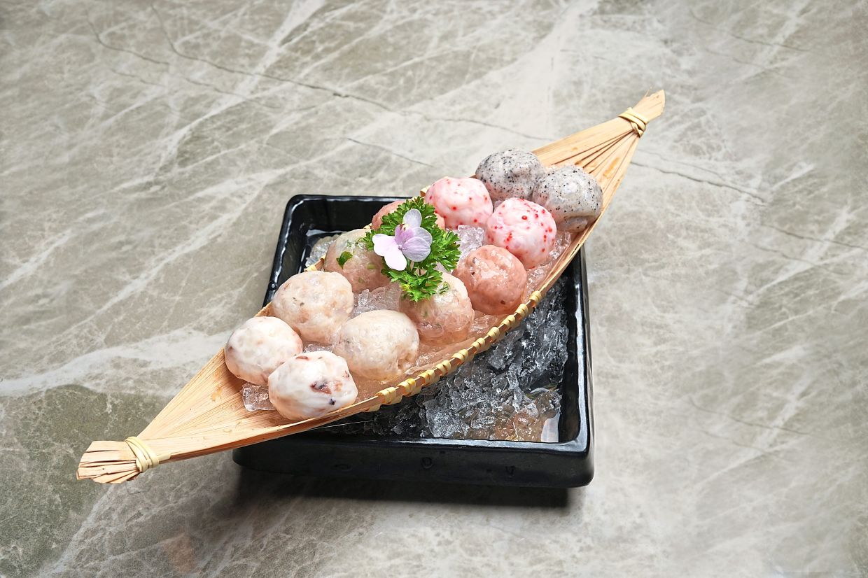 All the meatballs at the restaurant are handmade and as a result, each one is a textural marvel. — Fu Pot