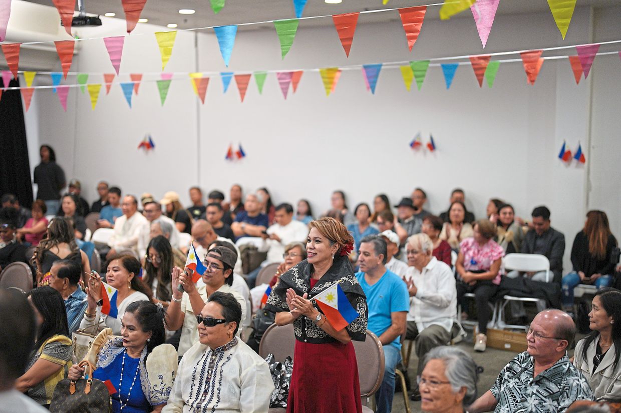 Attendees at an event celebrating the designation of Filipino Town in Las Vegas as a Clark County Cultural District. — Photos: AP