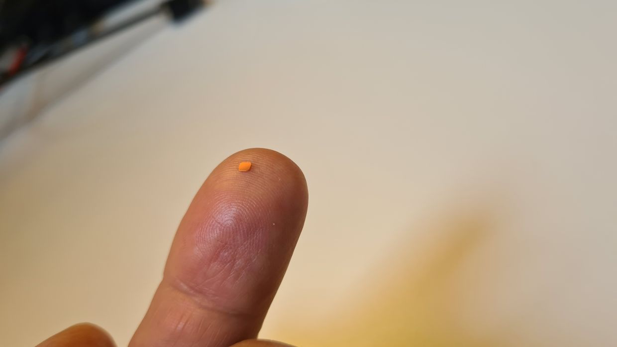 The tiny Prima chip (seen here) on a finger comes with augmented reality glasses and a pocket computer. — Science Corporation/dpa