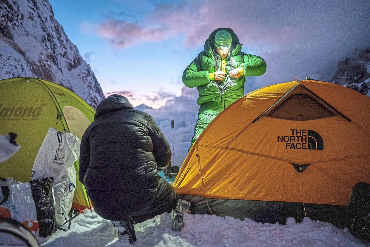 Vedrines (right) and his fellow French climbing partner Nicolas Jean making camp on their way to Jannu East. —QUENTIN DEGRENNE/AFP