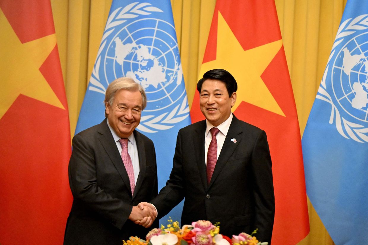 Vietnam's President Luong Cuong greeting United Nations Secretary General Antonio Guterres during a meeting at the Presidential Palace in Hanoi on Oct 24, 2025. - AFP