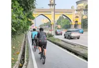 Sharing narrow bike lane fuels safety debate