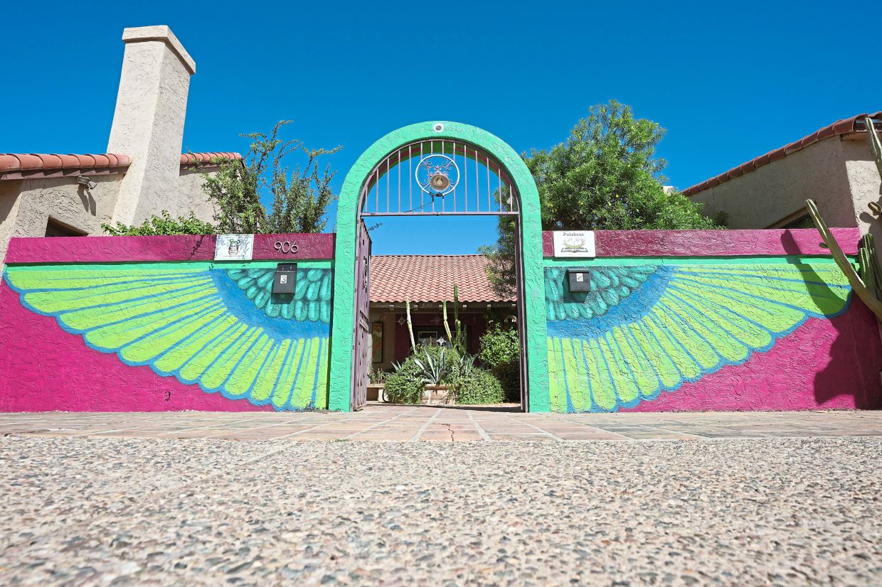 The main entrance of Palabras Bilingual Bookstore shows off colourful artwork, a theme throughout the bookstore. Photo: AP