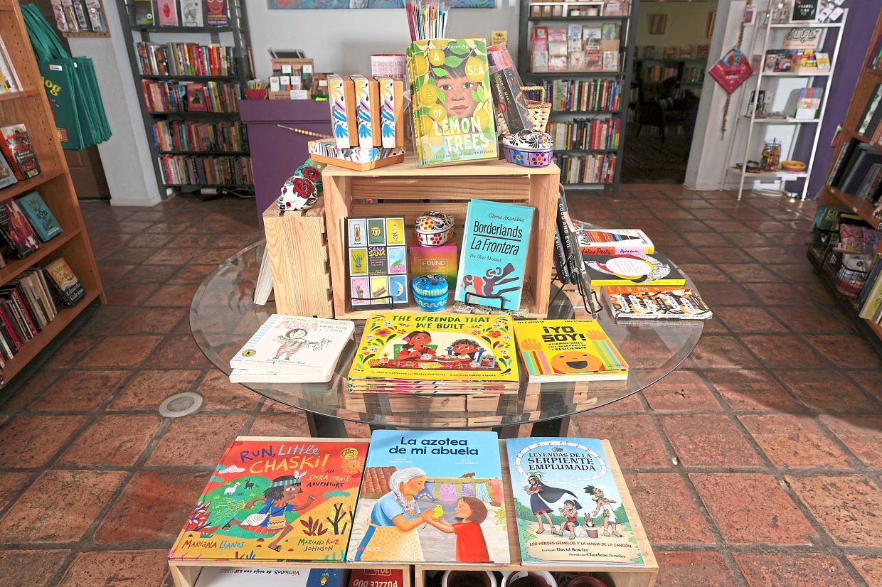 Books from Latino writers and illustrators are on display at Palabras Bilingual Bookstore. Photo: AP