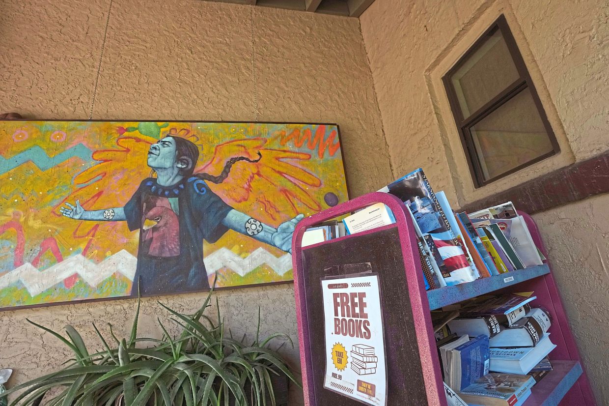 A free books trolley sits in front of Palabras Bilingual Bookstore. Photo: AP