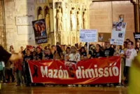 Protesters urge regional Spanish leader to quit a year after deadly floods