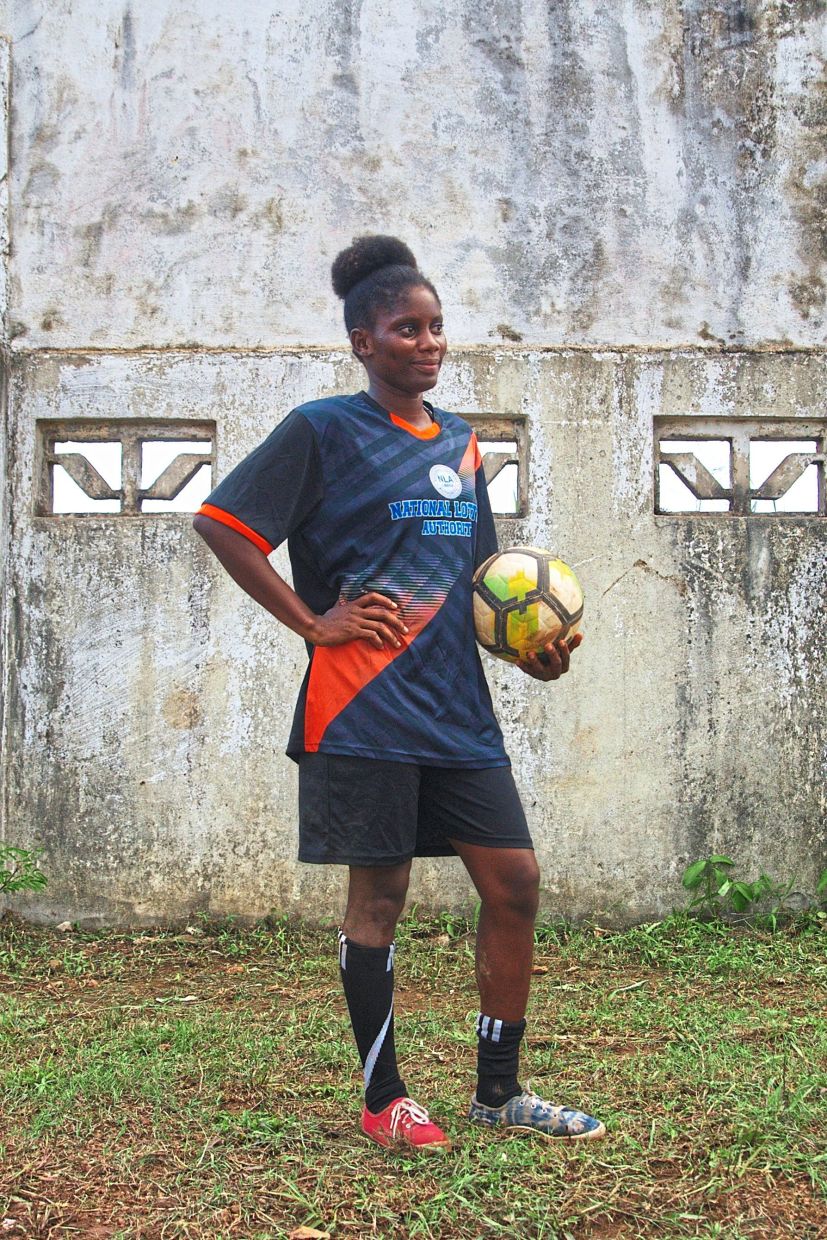 Perryline Jimmie, 23, of the Gisa kickball team, poses for a photo after a match. — AP 