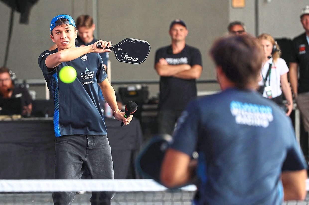 Team Williams drivers Alexander Albon and Carlos Sainz play pickleball prior to practice ahead of the F1 Grand Prix of United States at Circuit of The Americas in Austin, Texas, on Oct 17. — AFP 