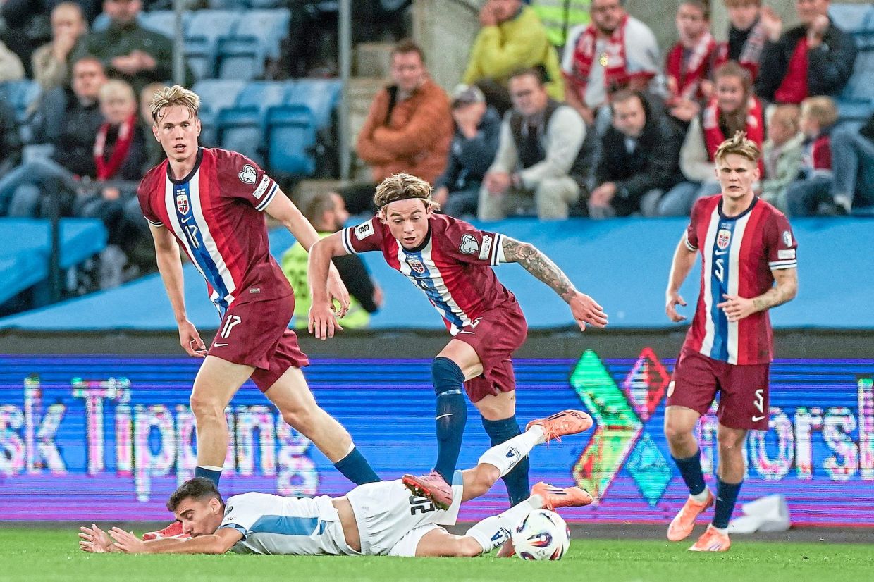 Norway’s Patrick Berg (centre) vying for the ball with Israel’s Dan Biton. — AFP