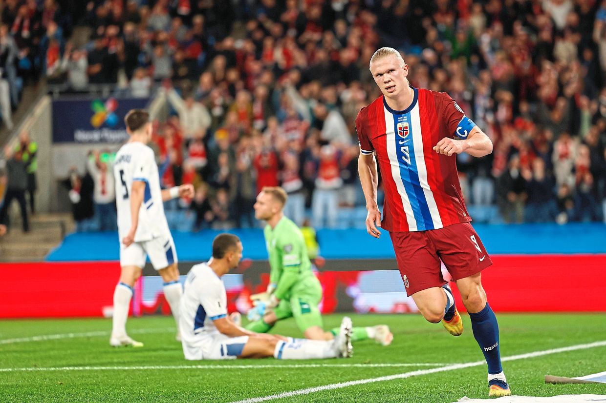 Erling Haaland celebrates scoring the second of his three goals in Norway’s 5-0 win. — AP