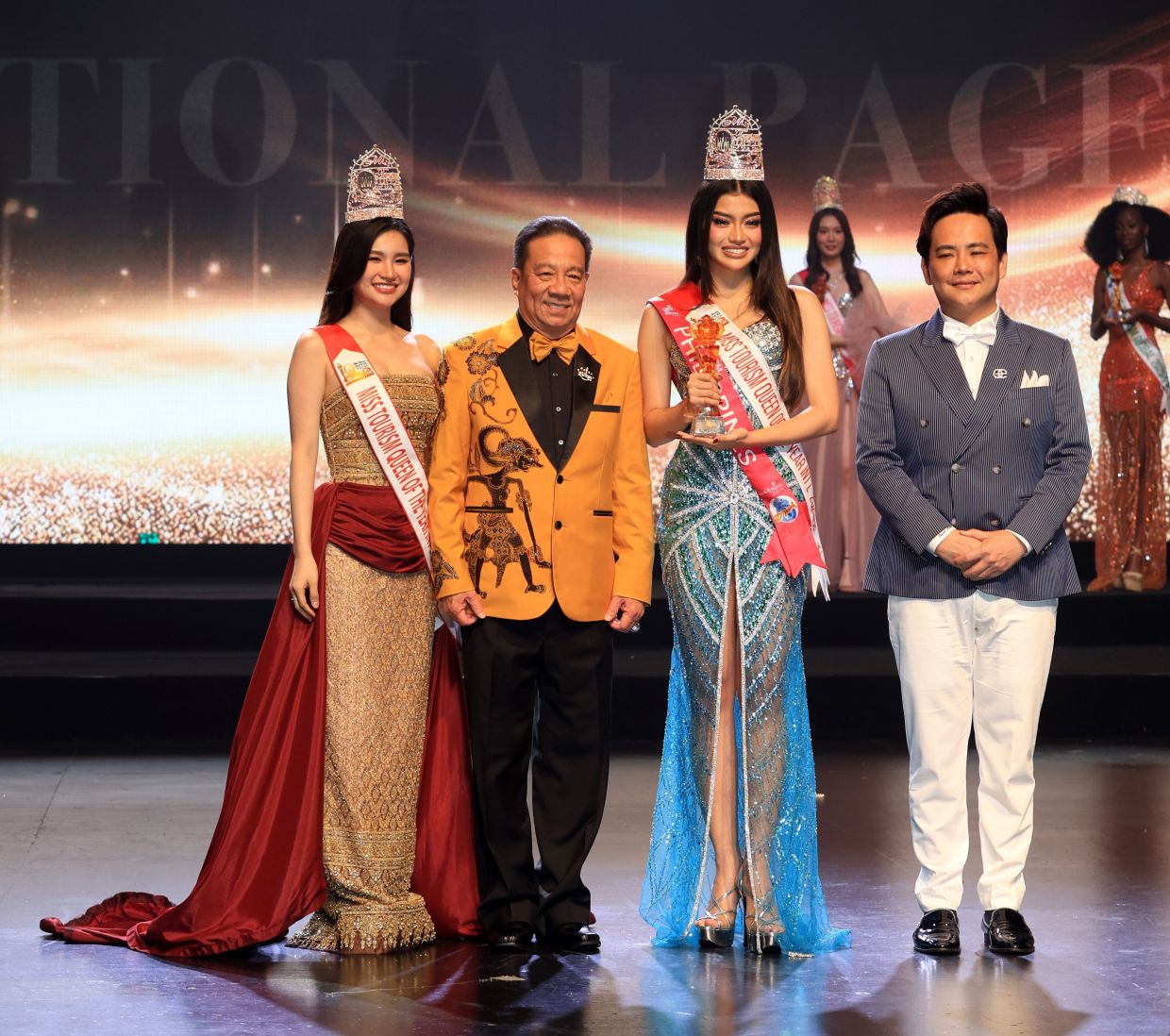 Enero holding her trophy while posing with (from left) Miss tourism Queen of the Year International 2024/25 Natta Intasao, Ooi and Khiu in Genting Highlands.