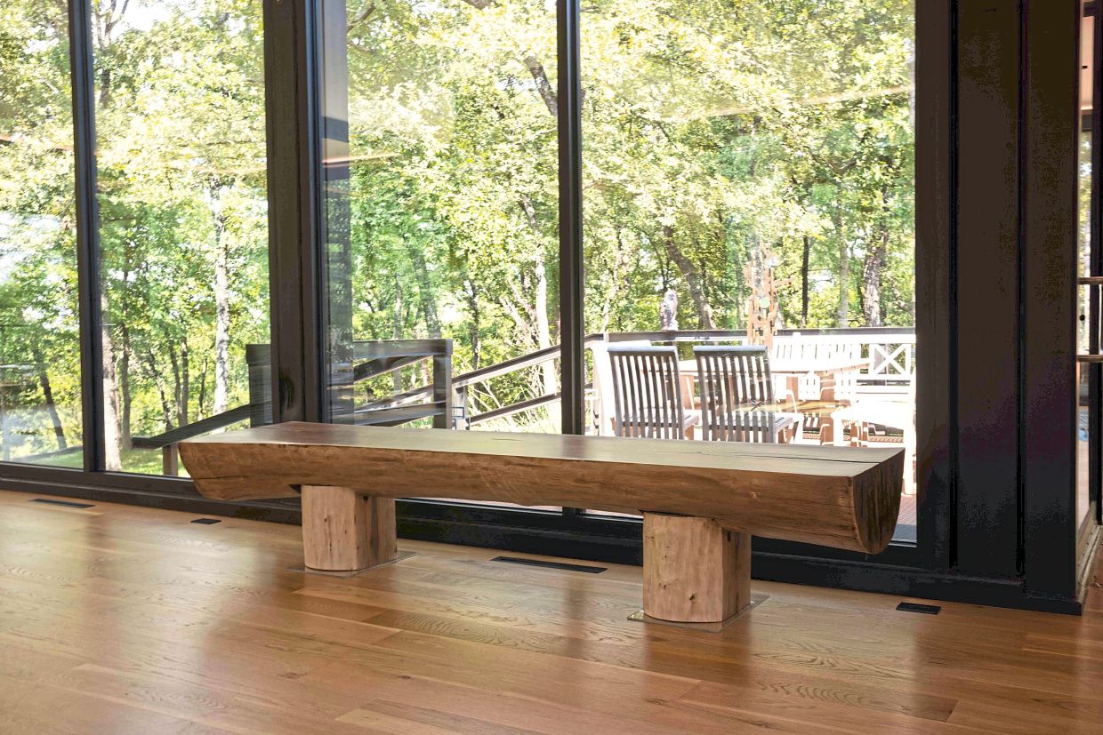 A black walnut log from Oklahoma is sliced in half and used as a bench. 