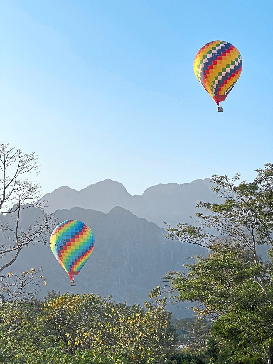 Enjoy hot air balloon rides in Laos’ adventure capital, Vang Vieng. — Unsplash