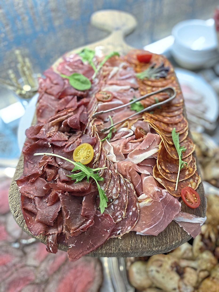 A Megeve-style charcuterie board filled with delicious cold cuts.