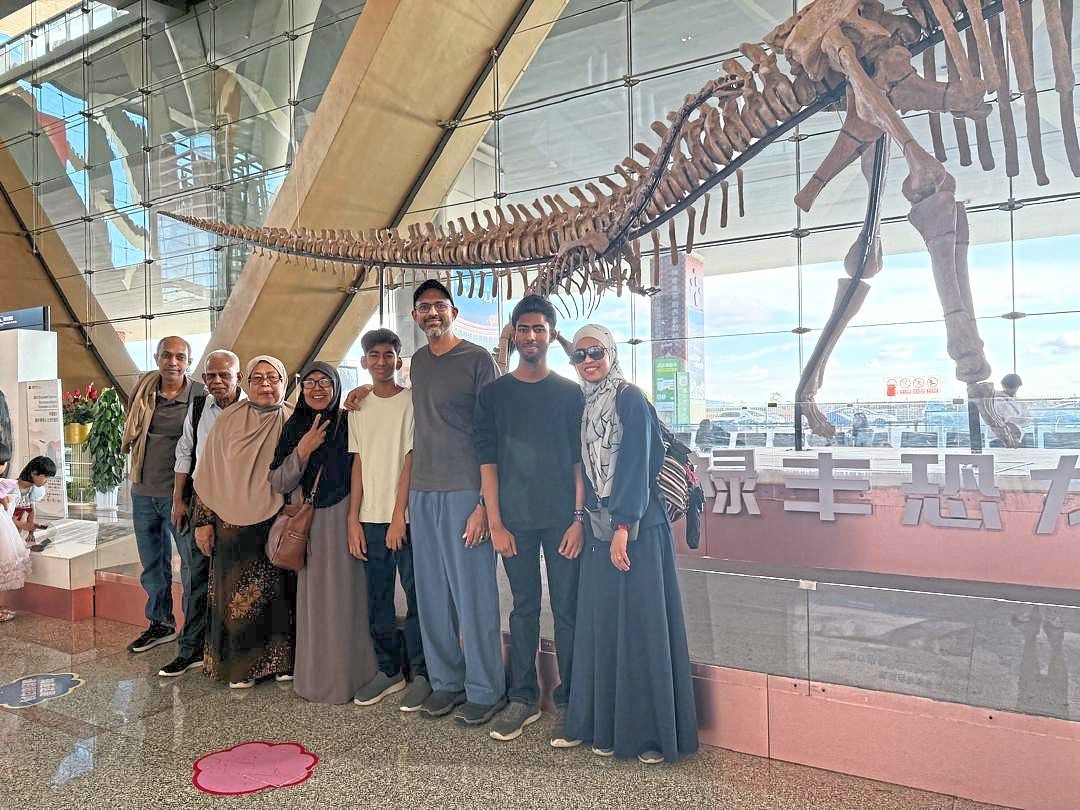 The writer (third from right) with his family at the Kunming Changsui International Airport.