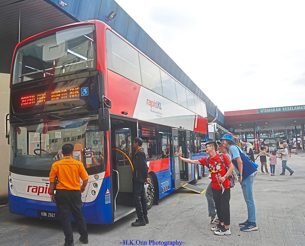 Bus enthusiasts admiring and taking photos of a double-decker bus during the Rapid Bus Open Day in 2023. — Courtesy of ALVIN HO
