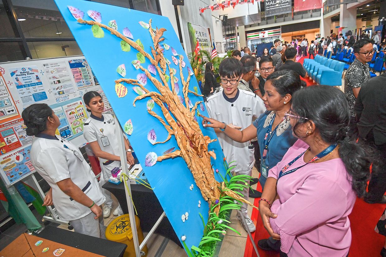 Students showcasing their work at UOW Malaysia – Global Climate Action Carnival 2025.