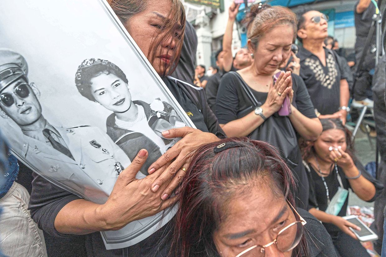 Mourners gathering outside the Grand Palace. — AFP/AP