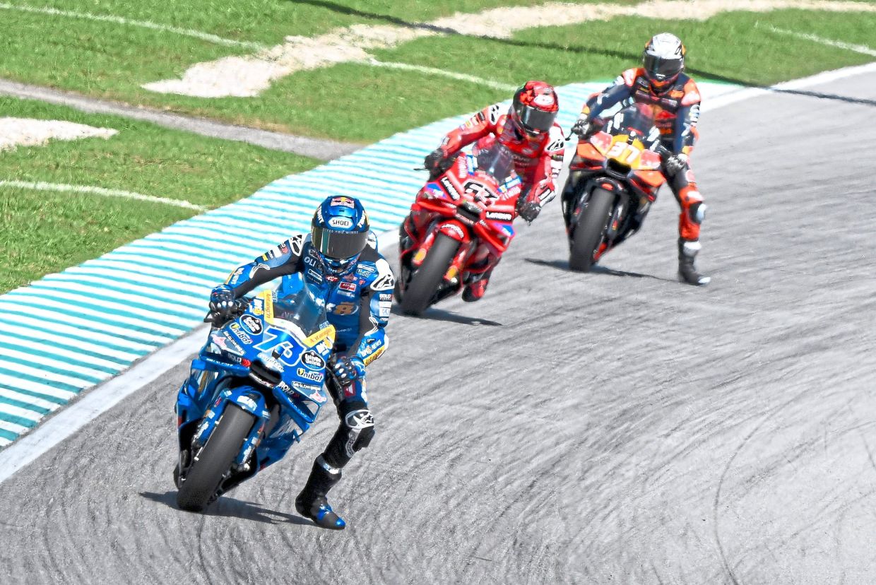 Going steady: Alex Marquez (left) leading the MotoGP race of Petronas Grand Prix of Malaysia.