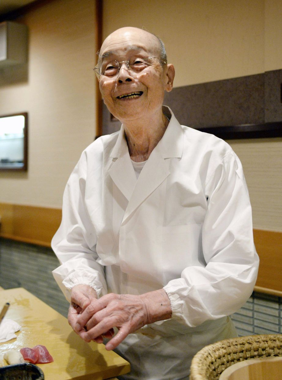 Sushi legend Jiro Ono makes sushi at his sushi restaurant on Oct. 29, 2014 in Tokyo, Japan. (Kyiodo News via AP)