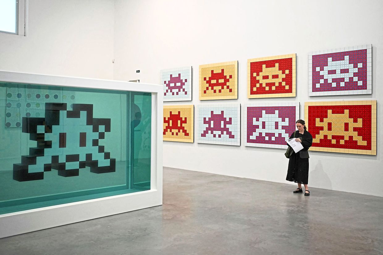 The exhibition of individual and collaborations by Fairey, Hirst, and Invader entitled ‘Triple Trouble’ will run through March next year.