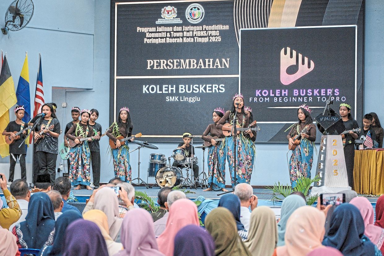 The Koleh Buskers take the stage at a community event, charming the audience with their lively performance.