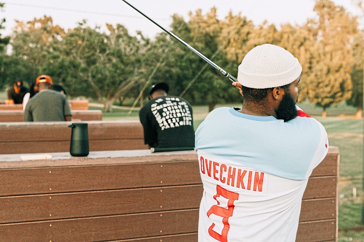 At Swang's Free Range sessions in Los Angeles, newcomers learn to golf to hip-hop and Afrobeats, shaking up the sport's traditional image.