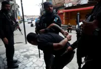 At least 64 killed in Rio police raids ahead of climate conferences