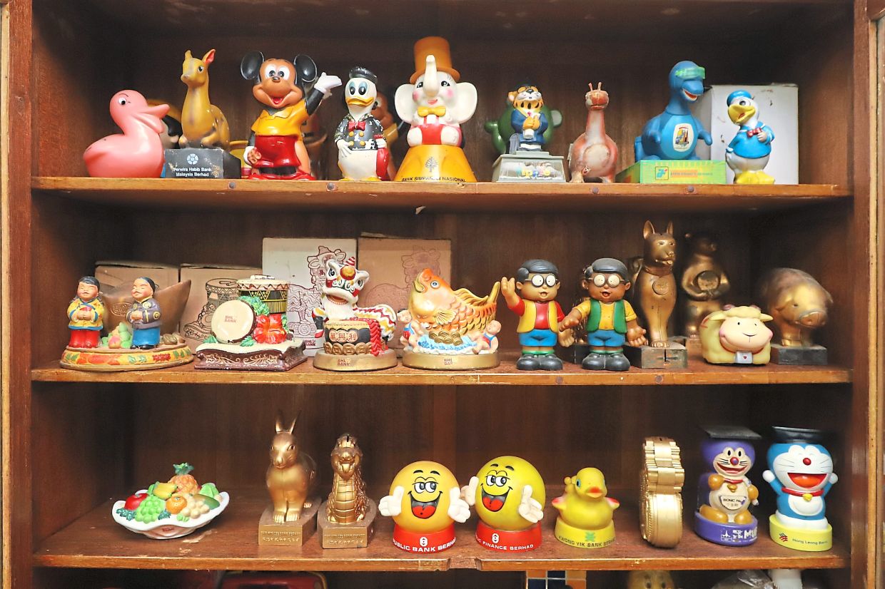 Teh’s collection of coin boxes taking pride of place at his service centre.