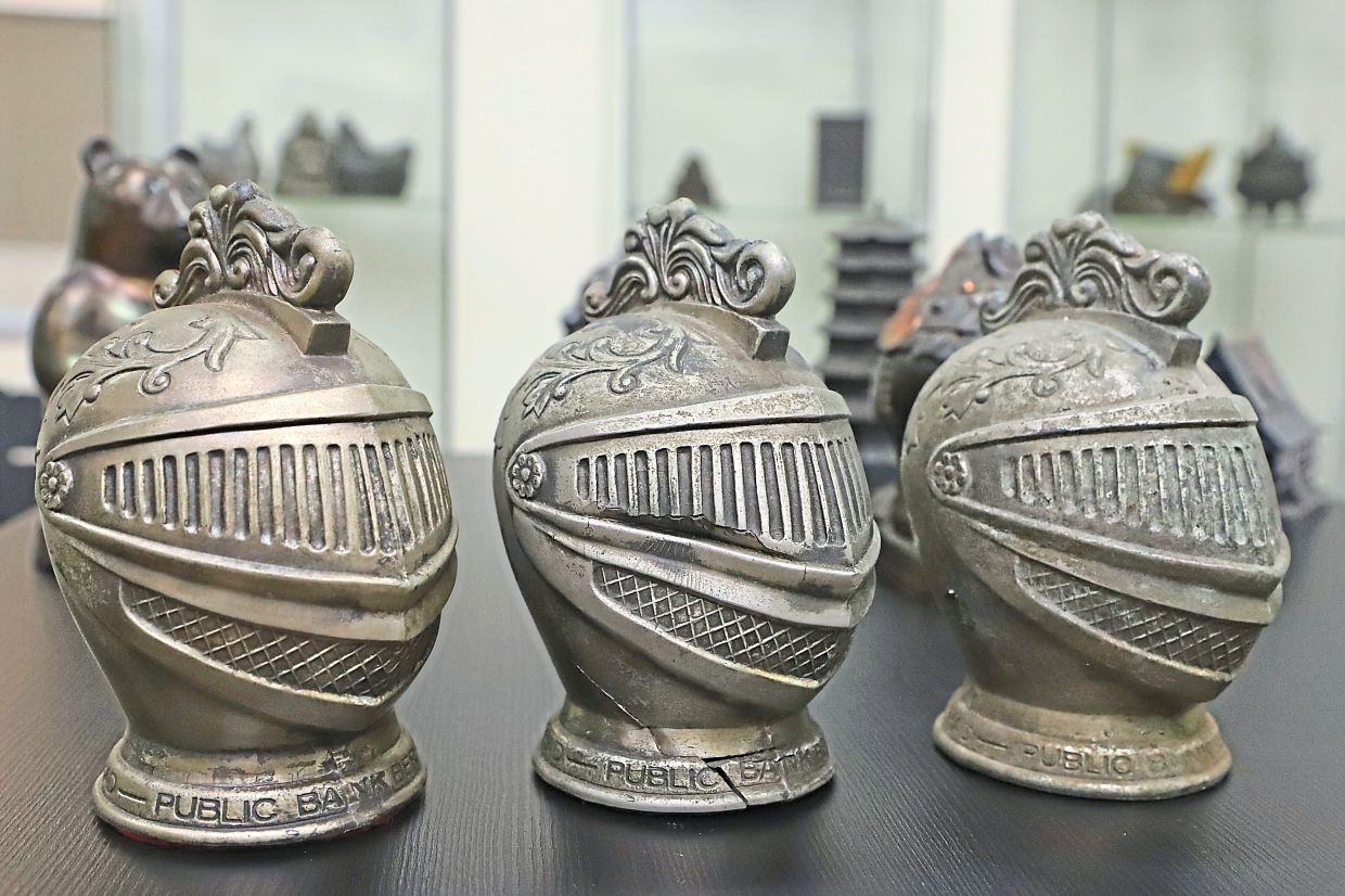 Unique coin boxes from Teh’s collection in the shape of knight’s helmets