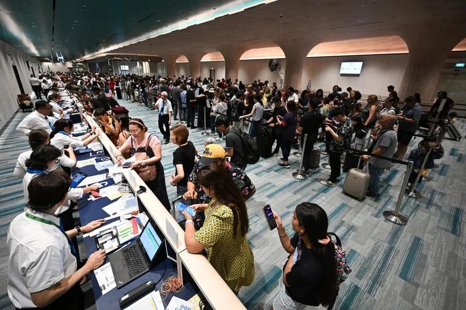 Passengers queueing inside the new check-in hall on level 1 of Marina Bay Cruise Centre. - Photo: ST