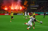 Soccer-Dortmund advance in German Cup after shootout win at Frankfurt