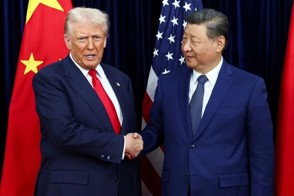Trump greeting Xi as they hold a bilateral meeting at on the sidelines of the Apec summit, in Busan on Oct 30. - Reuters