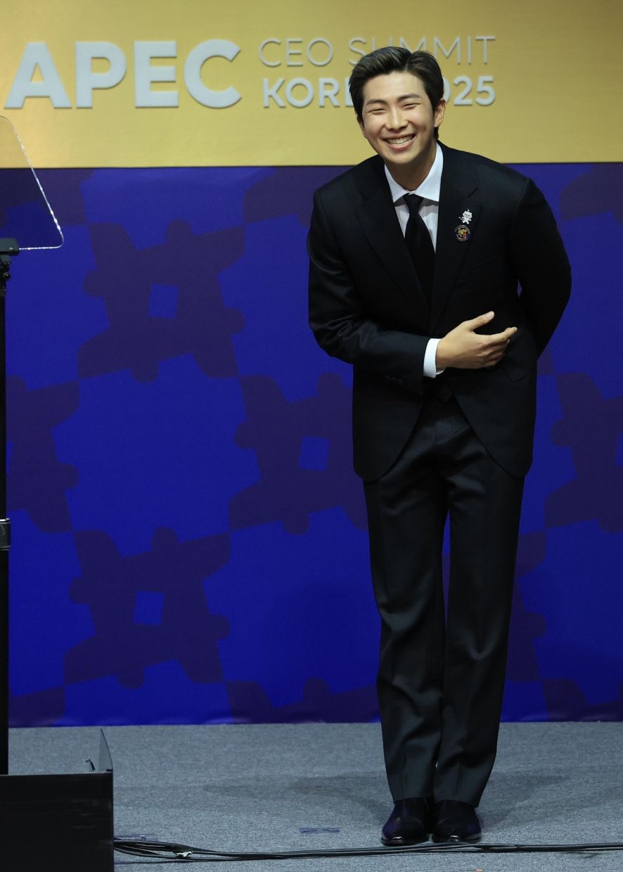 BTS leader RM greets the audience after delivering his speech at the 2025 APEC CEO Summit held at the Gyeongju Arts Center in North Gyeongsang Province on Wednesday. - Photo: Yonhap