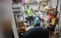 Enforcers uncover fake goods stores in small locked rooms at Petaling Street