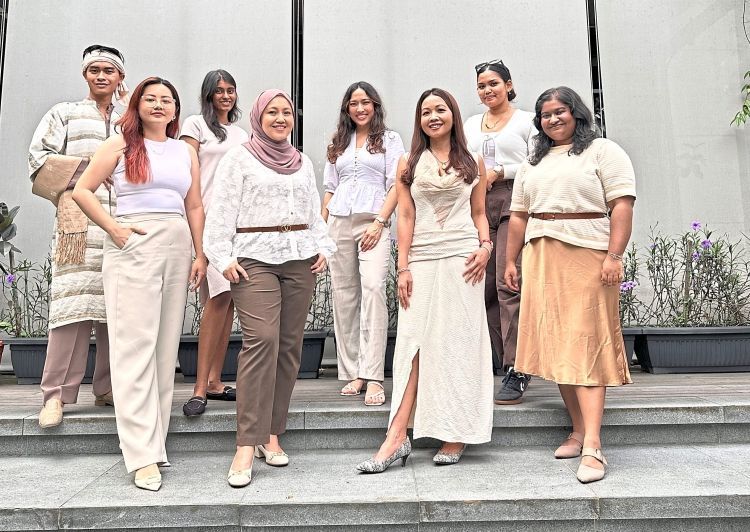 Kloth Circularity co-founders Suzy (first row, second from right) and Sarah (first row, second from left), together with their team working to champion textile circularity and sustainable fashion.