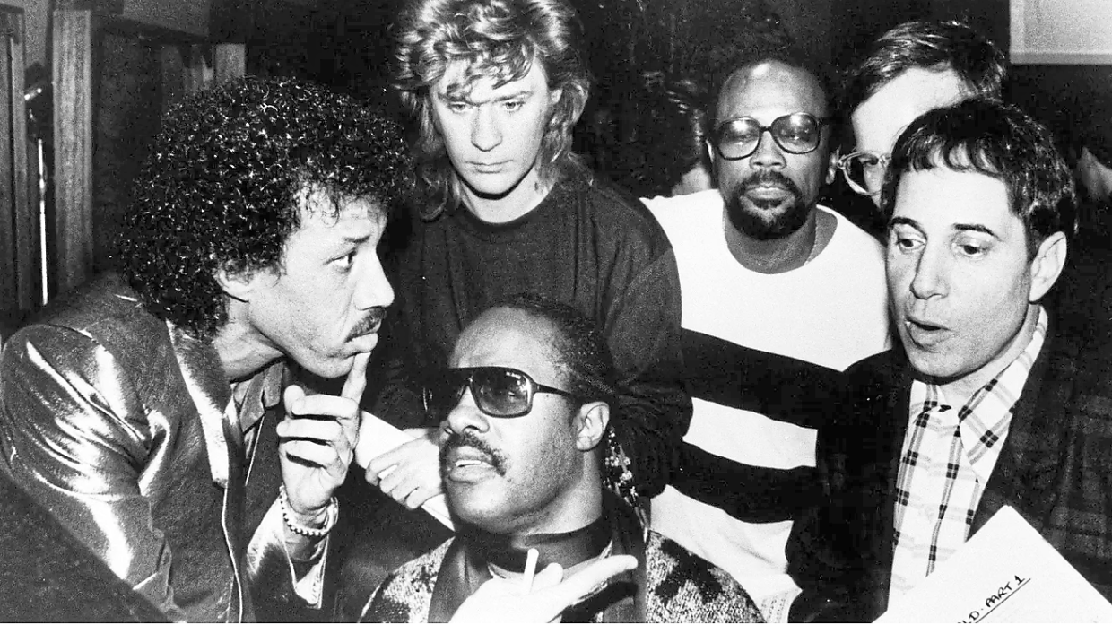 (From left) Richie, Daryl Hall, Stevie Wonder, Quincy Jones and Paul Simon at the recording of We Are The World. — AP