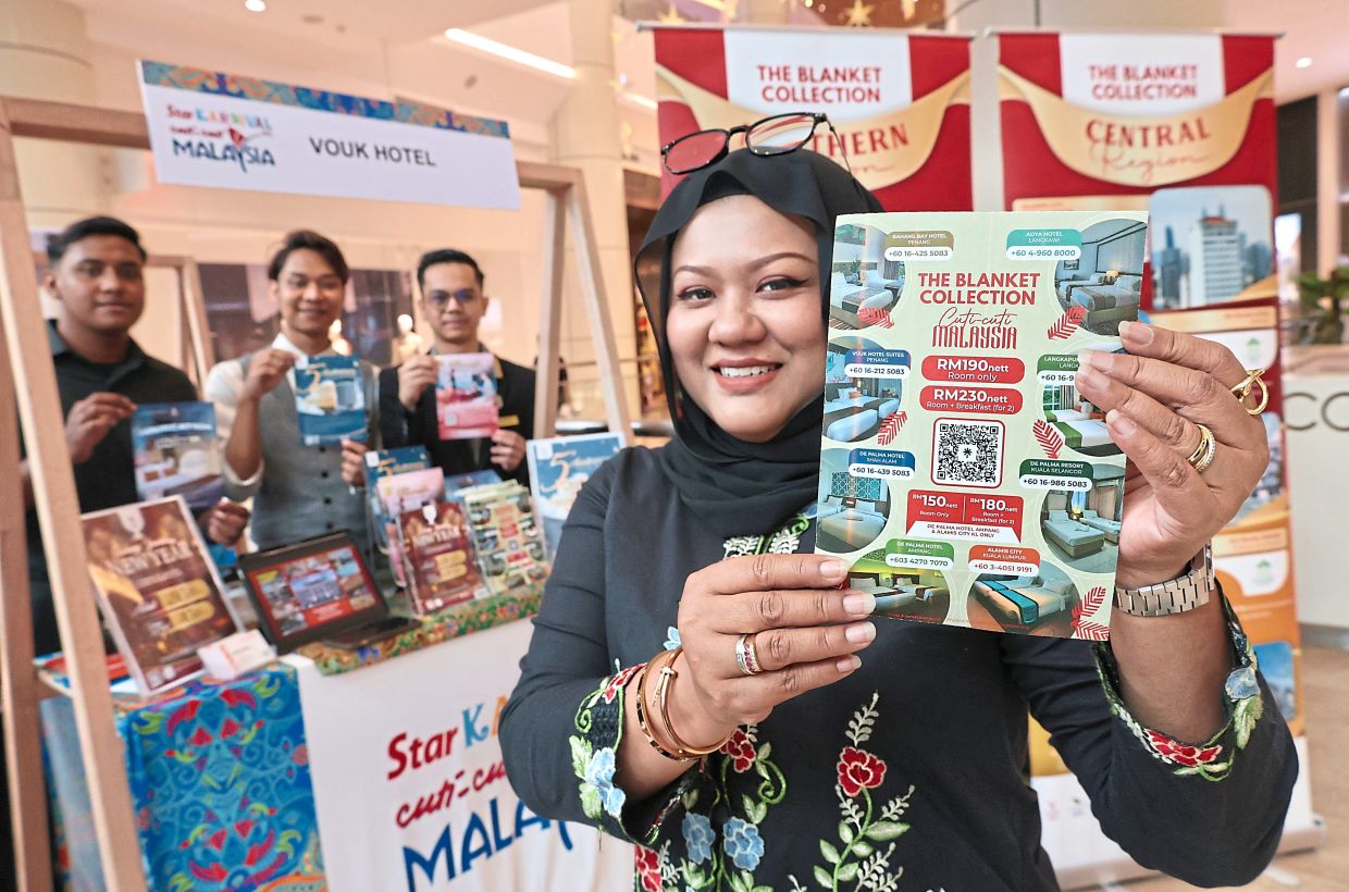 Mariana 在嘉年华上展示 The Blanket 连锁酒店和度假村提供的独家优惠。— ZHAFARAN NASIB/The Star