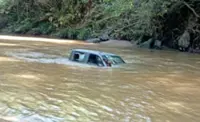 Two drown as 4WD swept away by swift-flowing river in Ranau